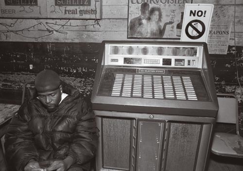 Black Man Next to Jukebox