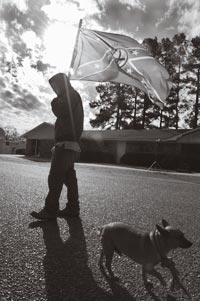 White Boy Carring Rebel Flag, with Dog Lead by Noose