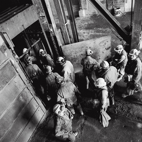 Miners entering the cage for the beginning of day shift at Kerr Mine No. 3 Shaft.