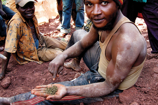 A miner shows a handful of the hash favored by the pit and tunnel miners at Bisie. 