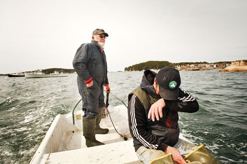 Captain Dick Bridges aboard his skiff after hauling traps with sternman Tom Hardy.