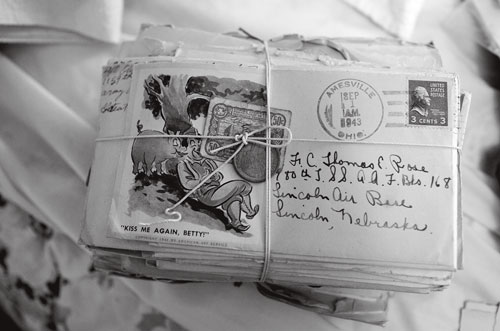 Correspondence between Tom and his wife Mary from WWII sits tied together in an upstairs bedroom.