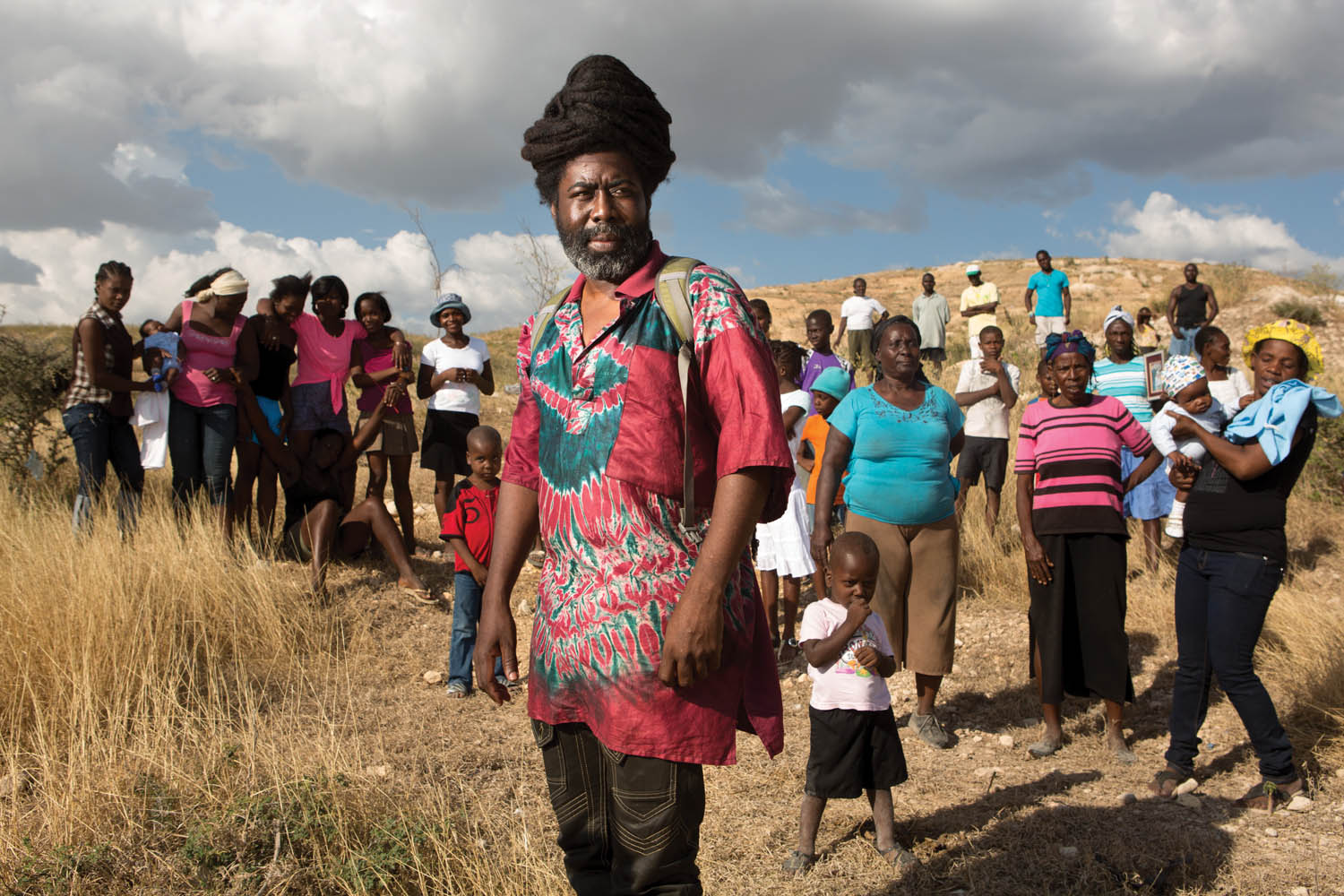 Mona Augustin at the site in Canaan where, in 2012, 126 families bought land rights in order to establish a camp they called Mozayik. Later, a competing, more powerful claimant forced them to move. Photo by Allison Shelley