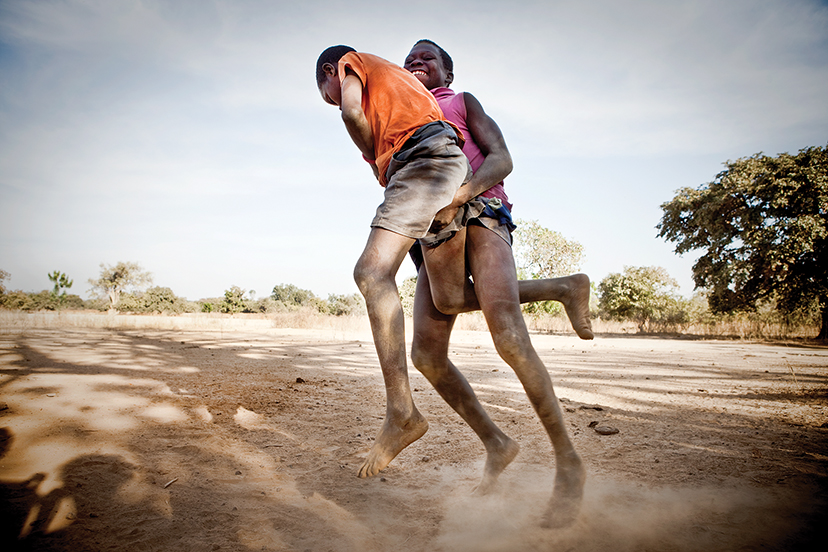 Young boys in the village of Karantaba wrestling in a traditional Gambian style. Karantaba was where, in 1791, Scottish explorer Mungo Park set out on his epic journey in search of the Niger River. below: Children in the village of Mandinari.