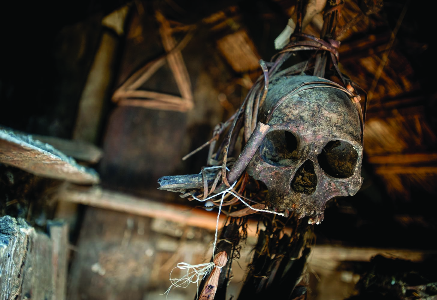 Legend has it that the skull hanging in the hut behind the chief of Pansar’s house once belonged to a Koki warrior. Despite its unimpressive setting, the chief said that the skull still has the power to cause trouble for anyone who disrespects it. Photo by Elliott D. Woods.