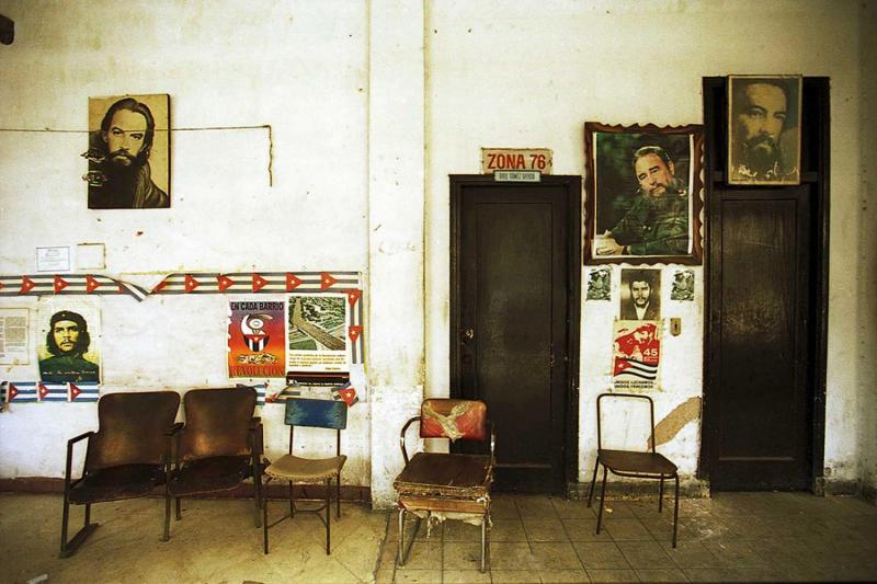 An office in Havana Vieja with the images of  revolutionaries, Fidel Castro, Ché Guevara and Camilo Cienfuegos.