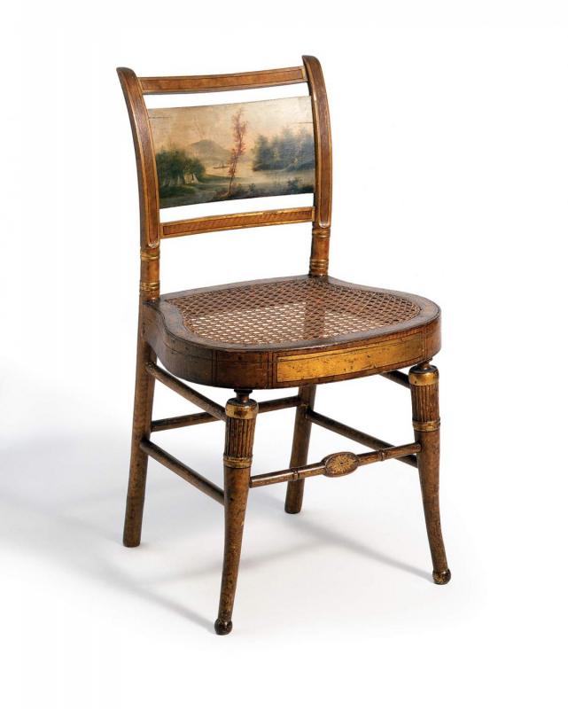 In America, Cole often earned money by decorating so- called “fancy” chairs and other furnishings. Such ornamentation frequently included miniature landscapes like this one, painted on a side chair by an unknown artist, circa 1815–1825. (Courtesy of the Winterthur Museum. Bequest of Henry Francis du Pont, 1957.1075.1.)