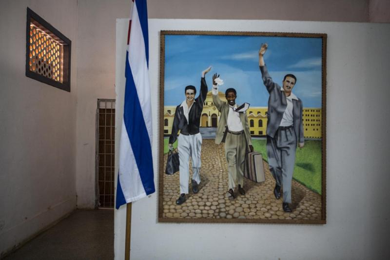 A painting depicting Raul & Fidel Castro (and comrade) being released from Presidio Modelo on May 15, 1955.