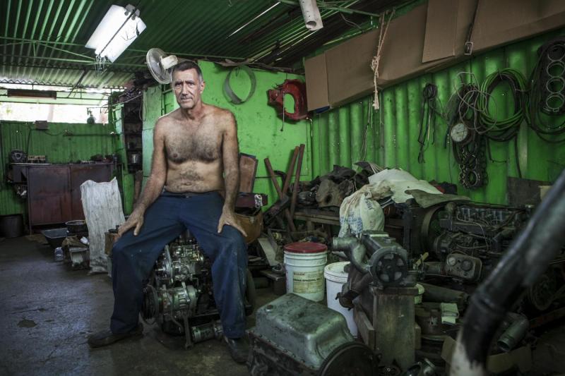 A mechanic in his machine shop, Quivican.