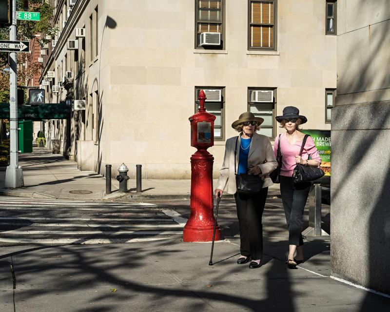 Women walking up Park Avenue, Upper East Side, New York.