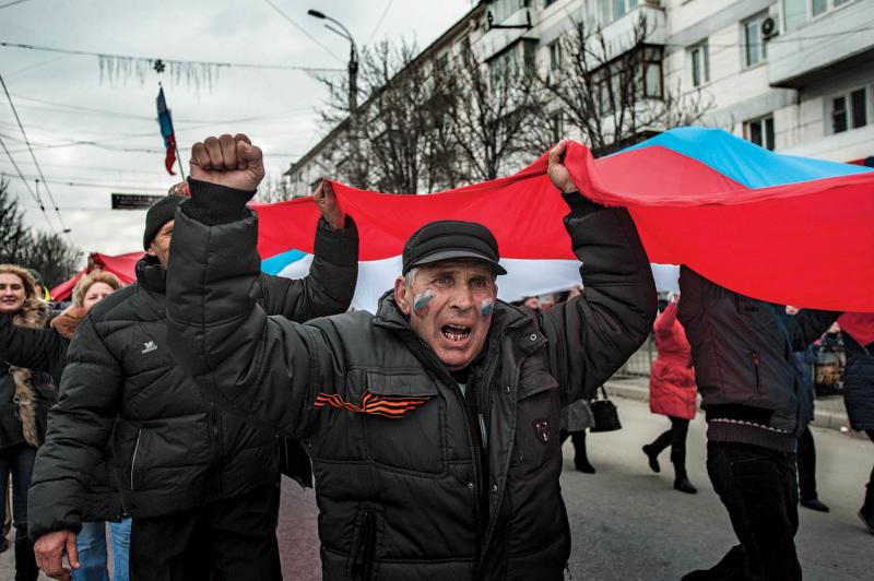 Pro-Russian supporters at a rally in Simferopol, March 9, 2014. Russian president Vladimir Putin officially recognized Crimea’s “reunification” with Russia on March 18, 2014.