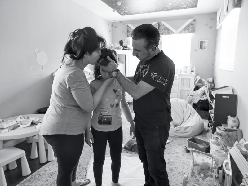 Ray Mirzabegian and Arsineh Yaghyaei attend to their daughter Emily as she recovers from a seizure. Los Angeles, CA, April 2018.