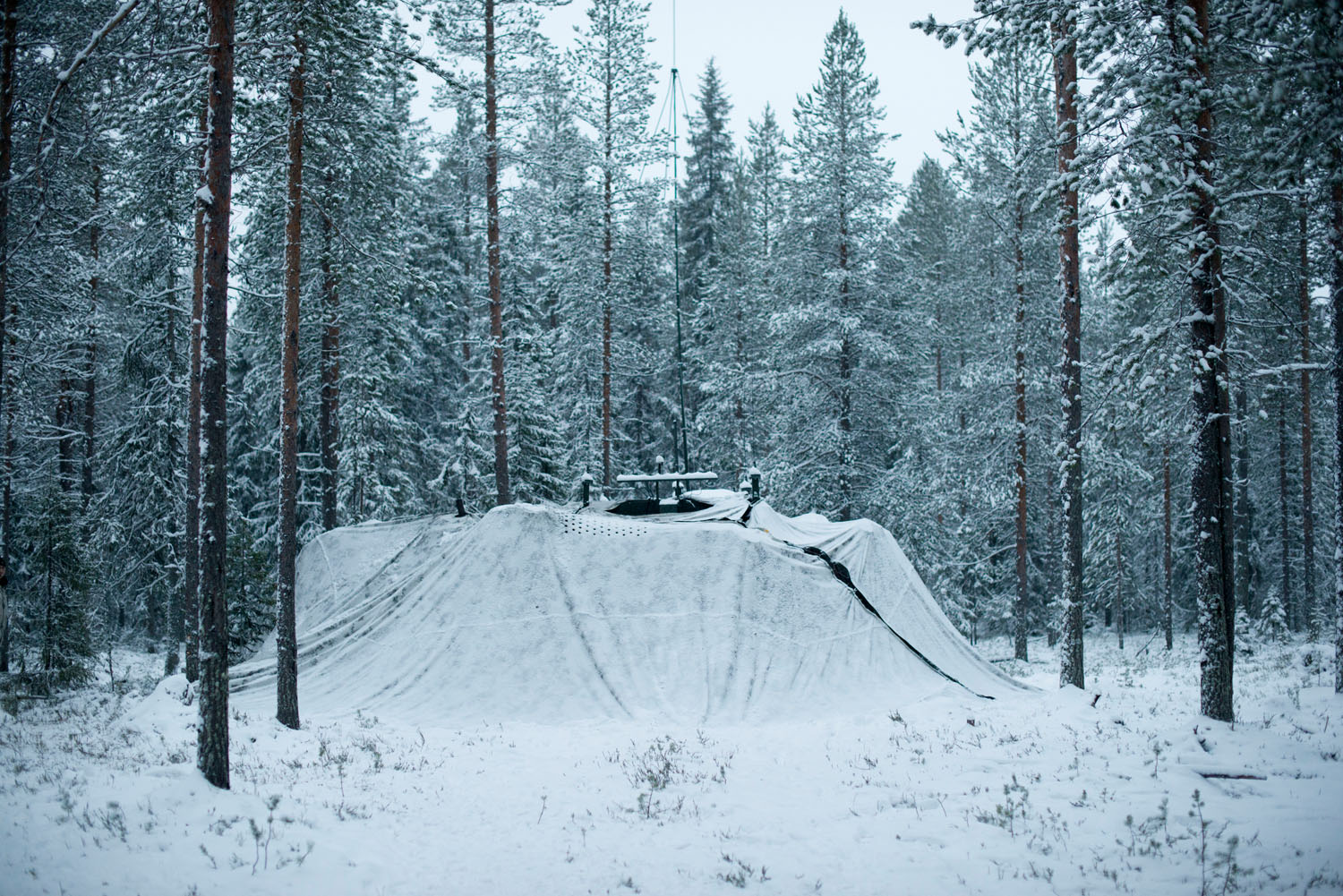 A camouflaged Finnish military command center in a forest east of Rovaniemi. Lapland, Finland, December, 2018.