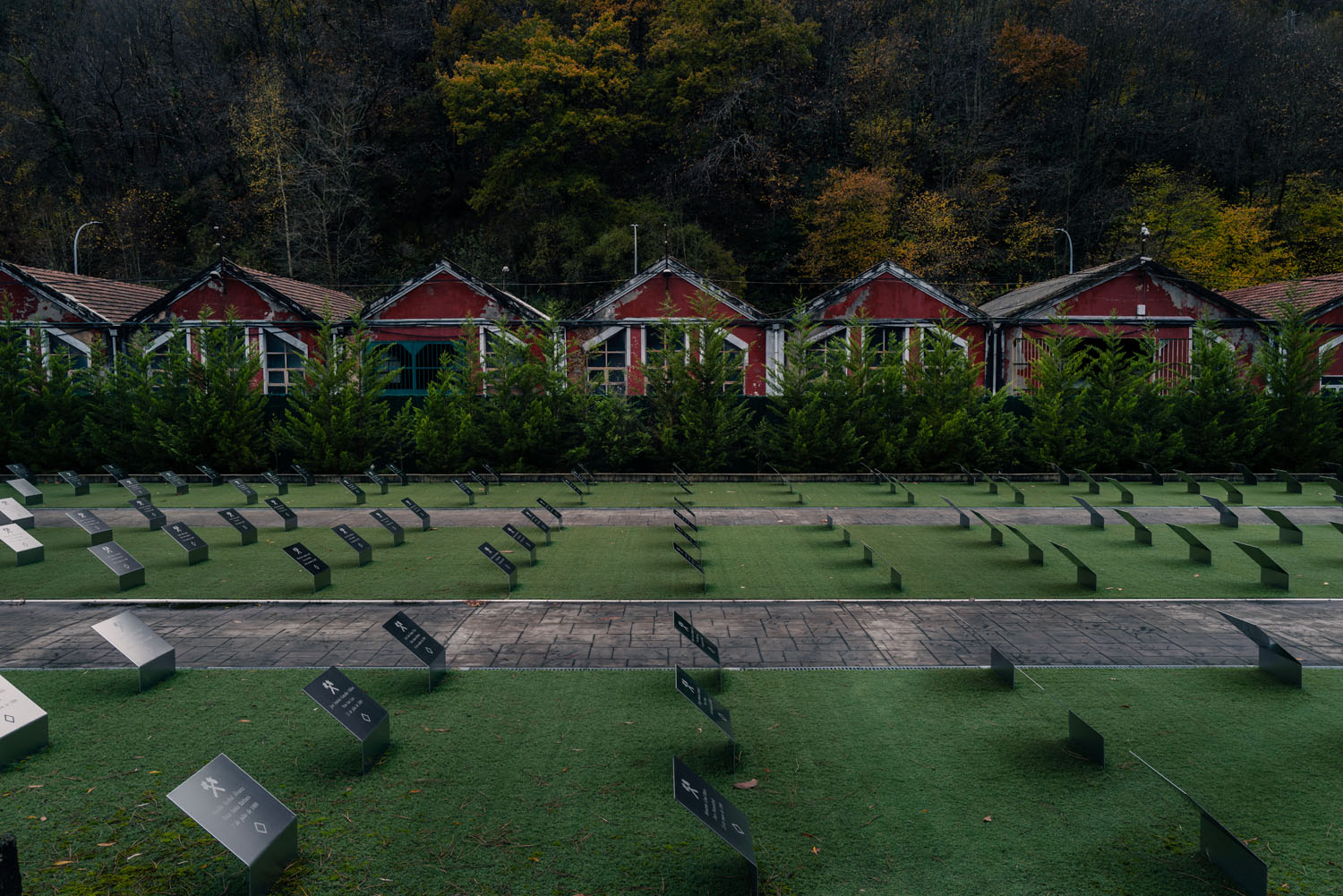 Uniform placards on the ground, evokes the impression of a cemetary