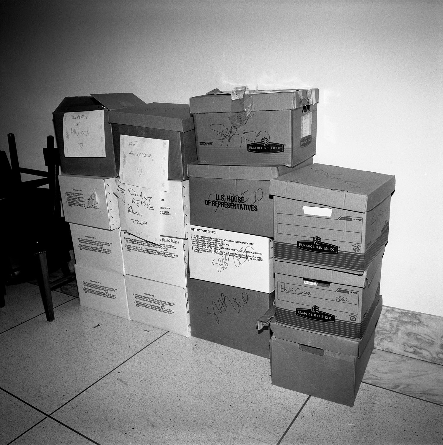 Boxes stacked in hallway.