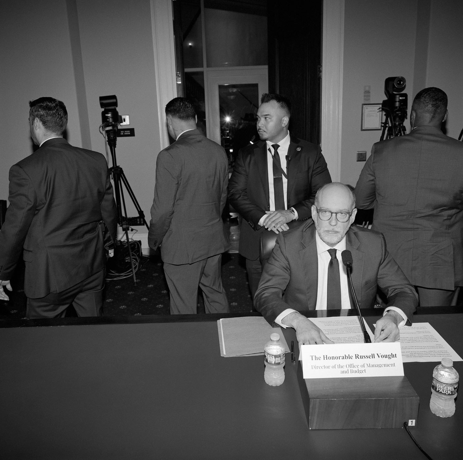 Man sits at desk.