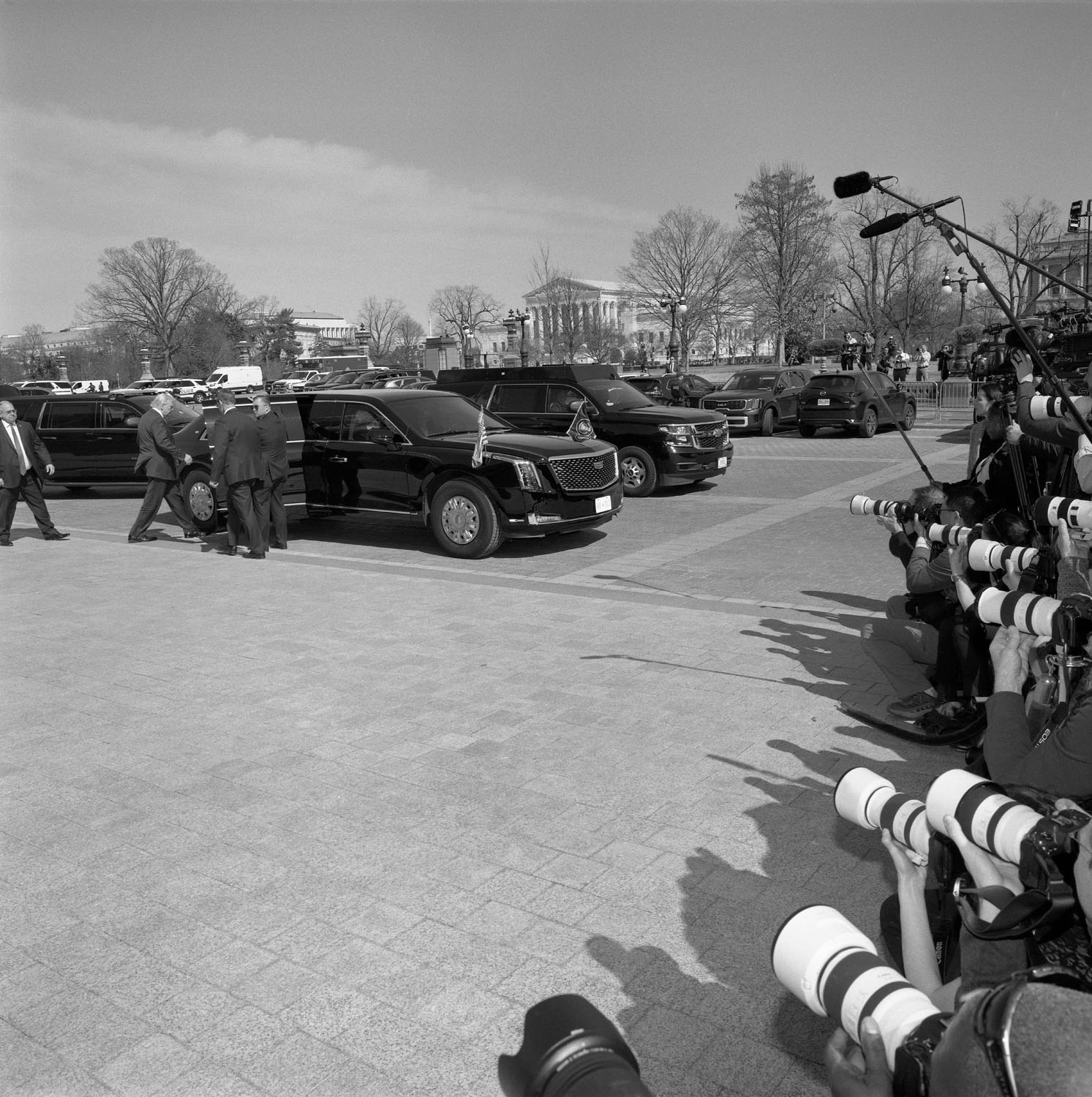 Cameras point at people and cars.