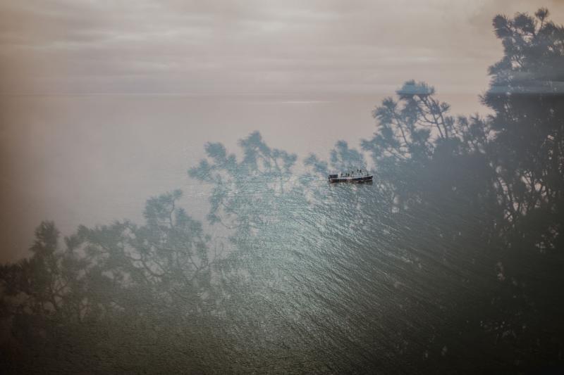 Boat on shadowy water