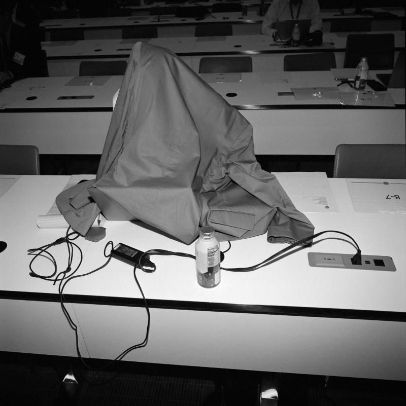 Covered object on desk.