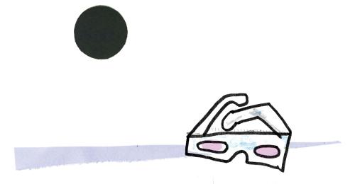 eclipse glasses with an eclipse looming above
