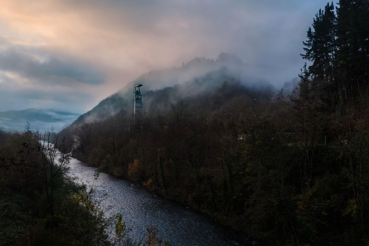 River running across the photo with mountains rising on both sides