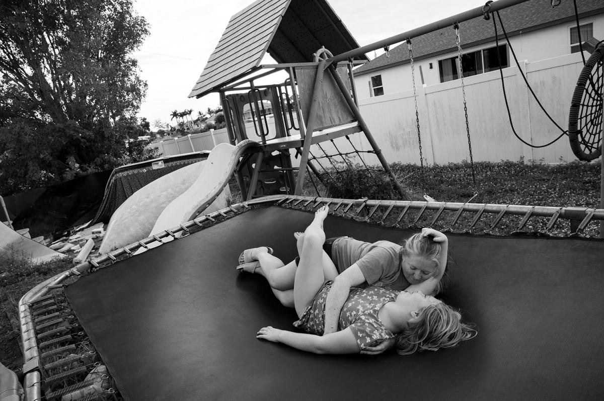 Hugging on trampoline.