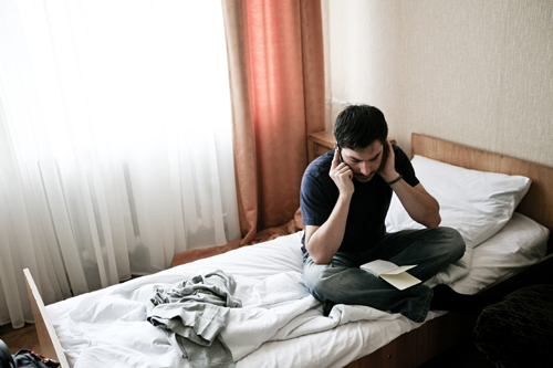 Dimiter Kenarov making phone calls from his hotel room in Minsk.