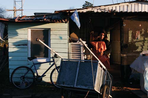 Woman in Front of Shack