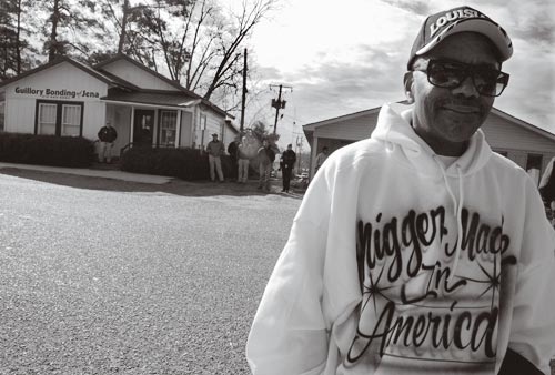 Black Man Wearing Shirt Reading 'Nigger Made in America'