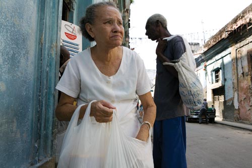Woman on Street with Grocery Bags