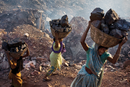 Women scavenge for coal illegally in Jharia.