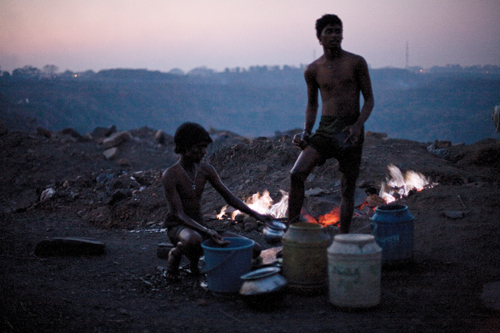 Dusk settles over Bokahapadi Village, lit at night by small coal fires.