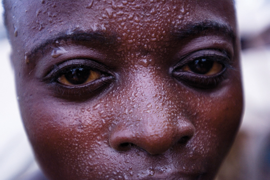 Sweat beads on the brow of one of the more than two thousand artisanal miners at Bisie, a cassiterite mine in the North Kivu province of the Democratic Republic of Congo