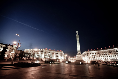 The illuminated monument to the dead of World War II in Victory Square, Minsk, Belarus.