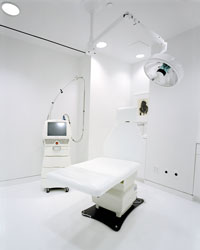 A sterile-looking pristine white room where cosmetic surgery consultations are performed