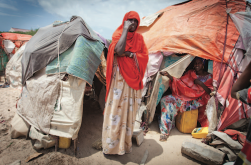IDP camps, like this one near the airport in Mogadishu, have sprung up all over Somalia’s capital city. The lack of aid available to them there has sparked a mass exodus of hundreds of thousands across the border into Kenya. Photo by Jason Florio