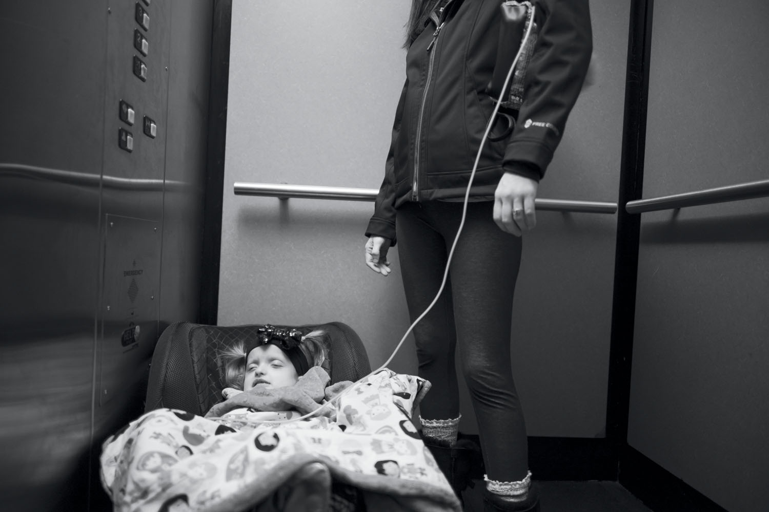 Maddie and Meaghan Holt on their way home from the hospital. Because of her condition, Maddie required intravenous feeding. Mount Vernon, WA, December 2017.