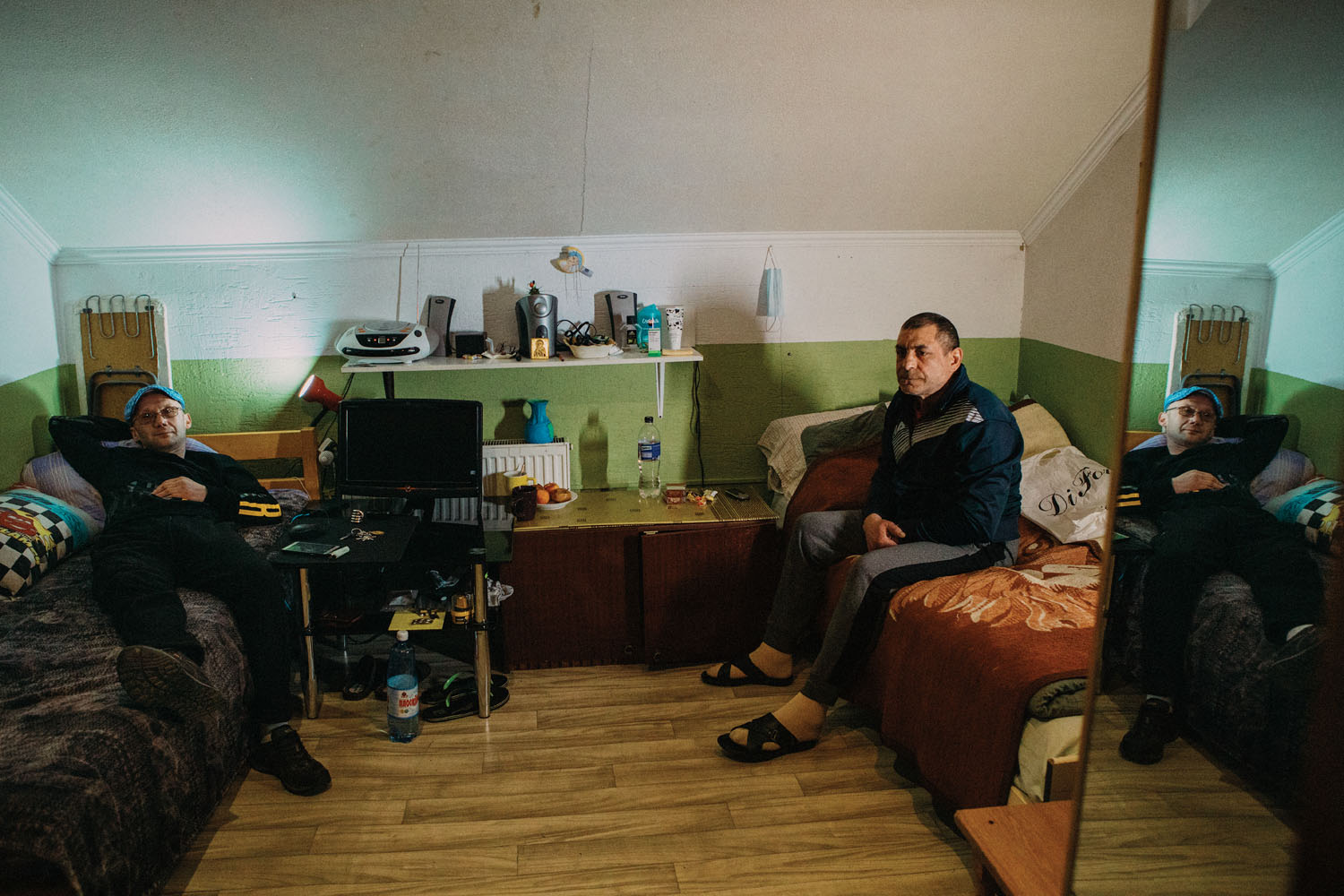 Pasha and Slavik in their shared bedroom. Shortly after this photograph was taken, Slavik was banned from the community for stealing deodorant from the community store. 2023.