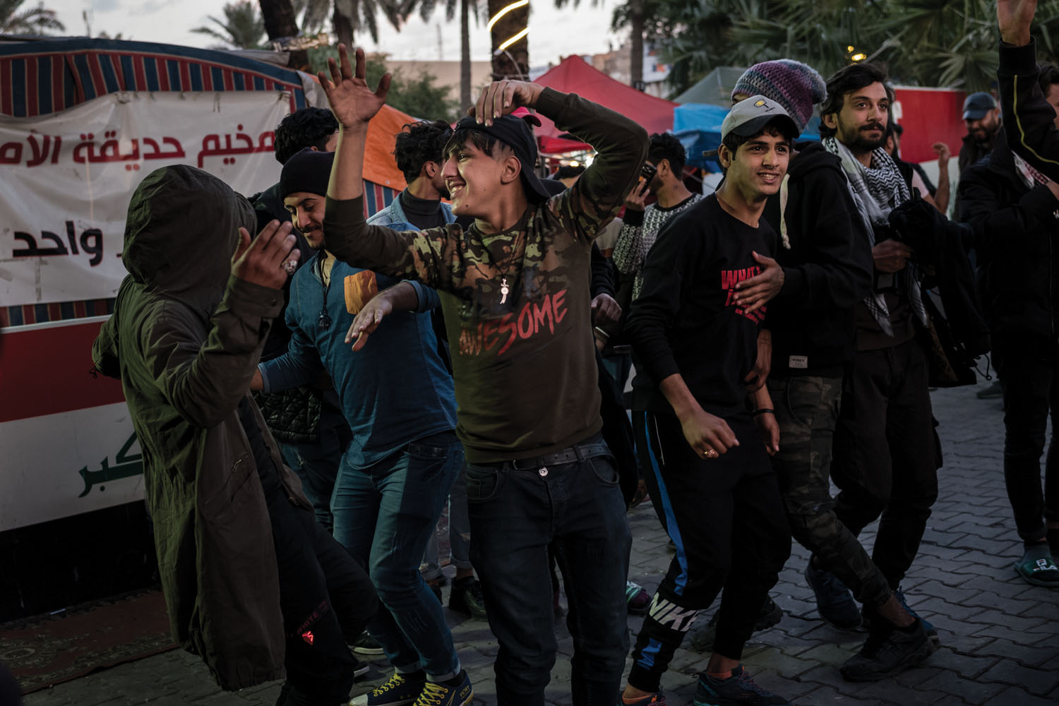 Protesters dance in front of their encampment in Tahrir Square. <i>Tahrir</i> translates to “liberation” or “freedom.”
