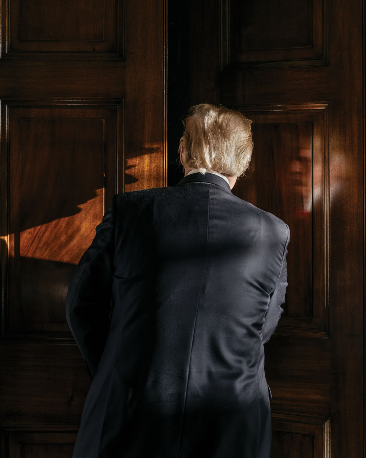 President Donald J. Trump entering his living room in the White House Residence. Photograph by Ben Rasmussen.