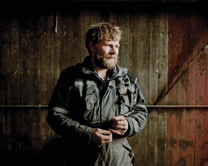 Sigert Patursson, one of the last Faroese farmers, in his barn outside of the town of Hoyvík.