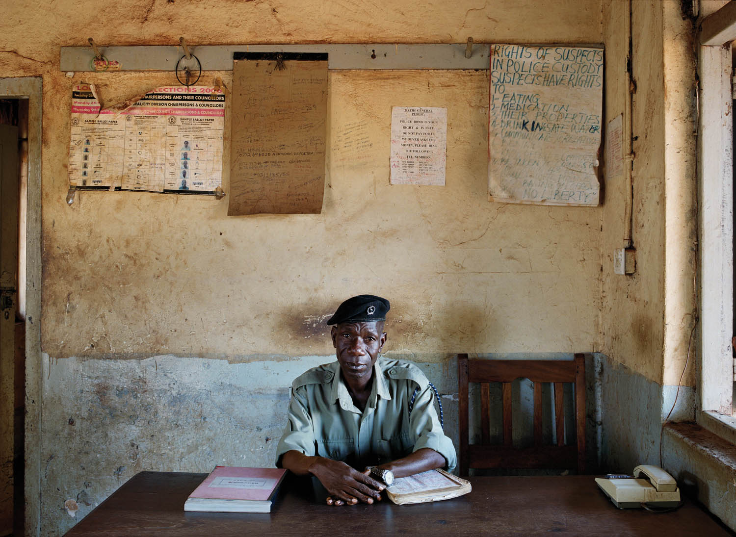 Constable # 11431, John Ndalira. Kakira Police Station. Jinja, Uganda, 2010. Photograph by Jan Banning. 