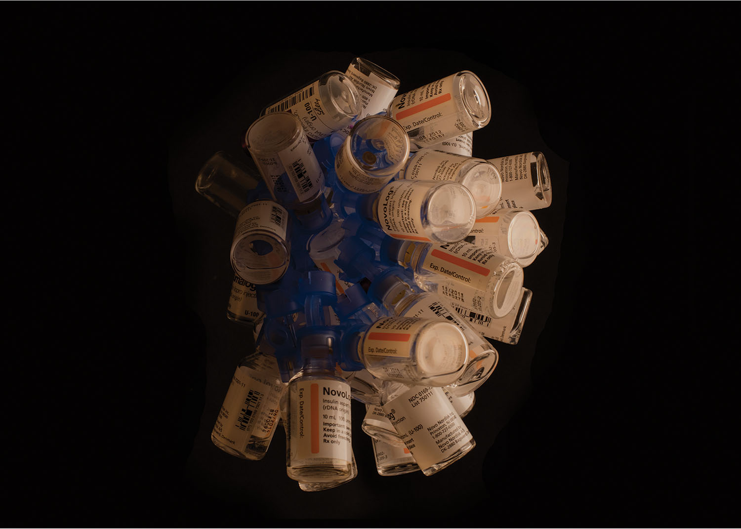 A collection of approximately six months’ worth of insulin bottles. This supply would have cost $3,000 ten years ago. Now it costs nearly $10,000. Photo by Stu Sherman.