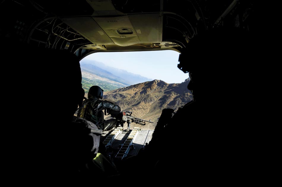 A CH-47 Chinook helicopter doorgunner on the approach to FOB Airborne in Wardak Province.