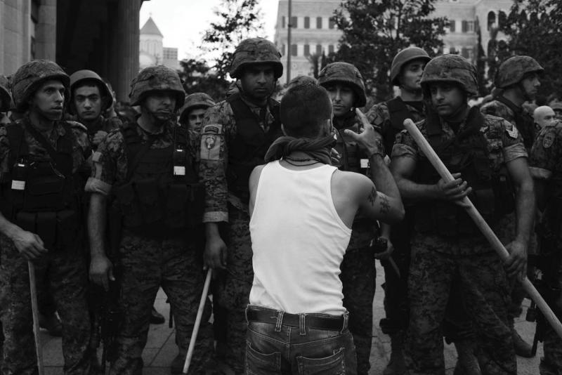A young man tries to reason with the security forces. Beirut, October 21, 2012. From Alex Potter's "After the Funeral."