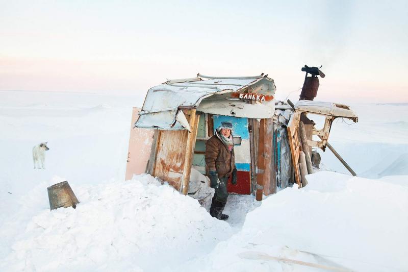 A Tiksi resident known affectionately as Uncle Vanya at his bathing shack in fall and winter, 2011. The shack serves as both a retreat and study where he writes a family-values column for the local newspaper, Lighthouse of the Arctic.