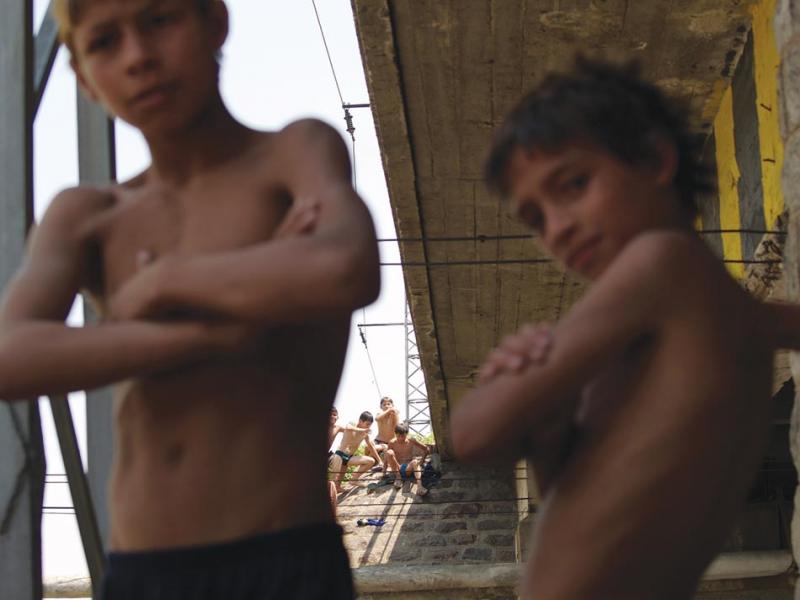 Roma children swimming under a bridge in Sliven (Dimiter Chaprazov).