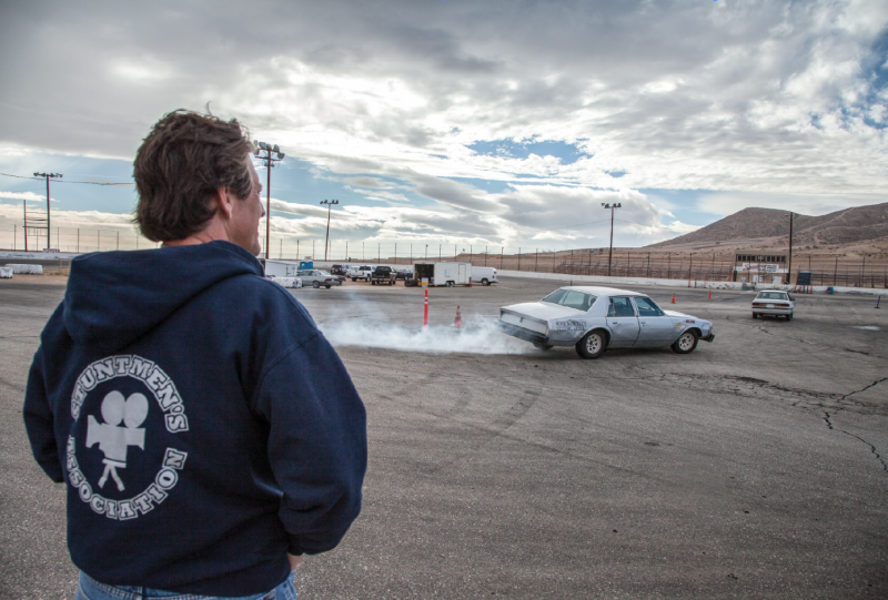 Veteran stuntman J. Mark Donaldson looks on as trainees practice stunt driving at a racetrack facility north of L.A. As president of the Stuntmen’s Association, the oldest group of its kind, he keeps an eye out for upcoming talent with well-rounded stunt skills.