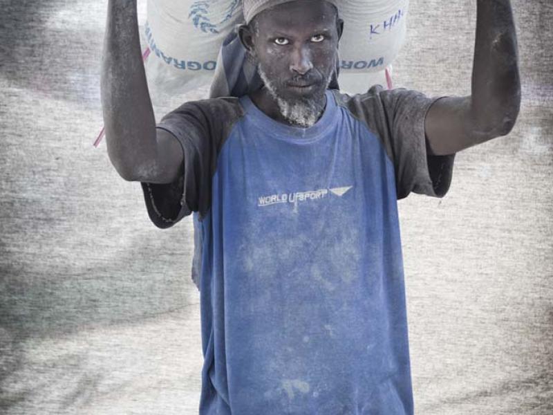 Hussein Moalim Mahdi, 50 — I’m a porter at a maize mill with a wife and six children. I can’t afford to send them to school on my salary, and unfortunately I can’t talk long because I only get paid for each bag I carry— ten cents per bag.