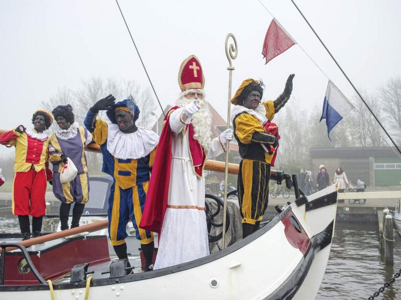 The arrival of Sinterklaas (Saint Nicholas) and Zwarte Piet (Black Pete) in a Frisian village in the Netherlands on November 24, 2012. (Patrick Post / Hollandse Hoogte)